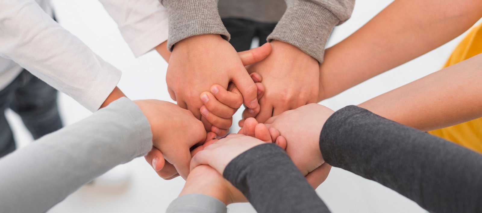 children-with-their-hands-together